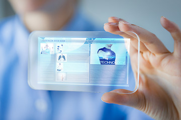 Image showing close up of woman with transparent smartphone