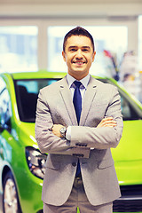 Image showing happy man at auto show or car salon