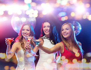 Image showing smiling women with cocktails at night club