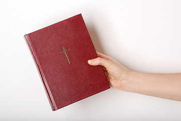 Image showing hand holding the book bible