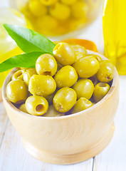 Image showing green olives and oil
