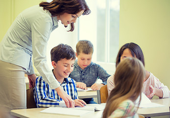 Image showing group of school kids writing test in classroom