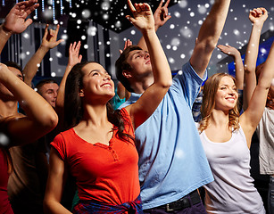 Image showing smiling friends at concert in club