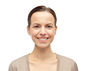Image showing smiling young woman in cardigan