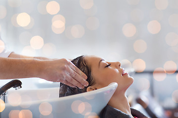 Image showing happy young woman at hair salon