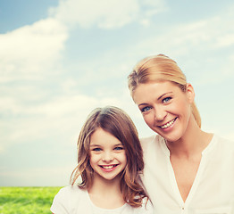Image showing smiling mother and little girl