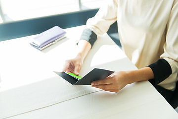 Image showing close up of woman hands holding restaurant bill