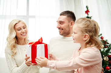 Image showing happy family at home with christmas gift box