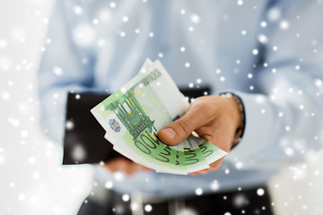 Image showing close up of businessman hands holding money