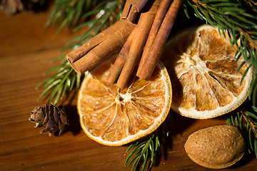 Image showing christmas fir branch, cinnamon and dried orange