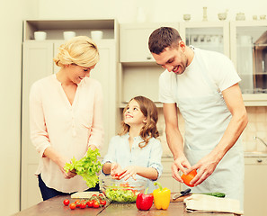 Image showing happy family making dinner in kitchen