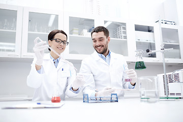 Image showing young scientists making test or research in lab