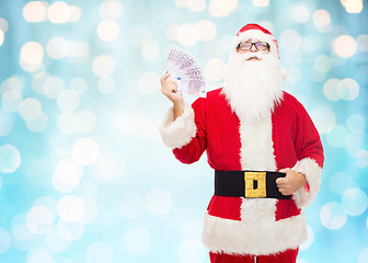 Image showing man in costume of santa claus with euro money