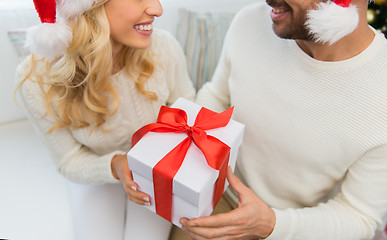 Image showing close up of couple with christmas gift at home