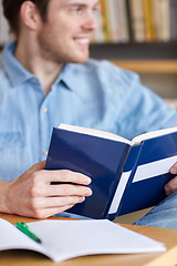 Image showing close up of student reading book at school