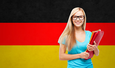 Image showing happy student girl with tablet pc and folders