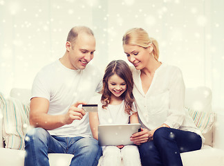 Image showing happy family with tablet pc and credit card
