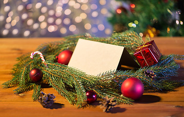 Image showing natural green fir wreath with note on wooden board