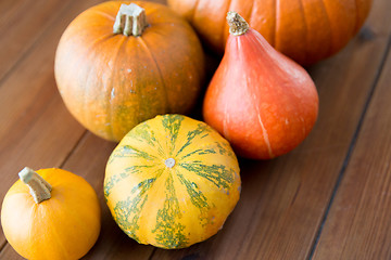 Image showing close up of pumpkins on wooden table at home