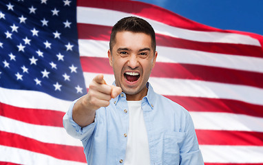 Image showing angry man pointing on you over american flag