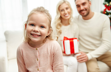 Image showing happy family at home with christmas gift box