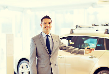 Image showing happy man at auto show or car salon