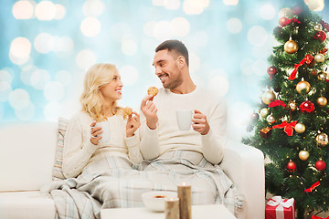 Image showing happy couple at home with christmas tree