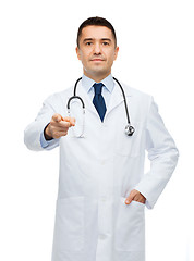 Image showing male doctor in white coat pointing at you