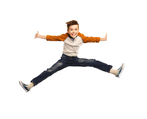 Image showing happy smiling boy jumping in air