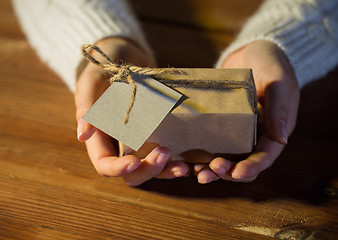 Image showing close up of woman with christmas gift or parcel