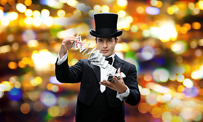 Image showing magician showing trick with playing cards