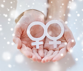 Image showing close up of happy lesbian couple with venus symbol