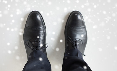 Image showing close up of man legs in elegant shoes with laces