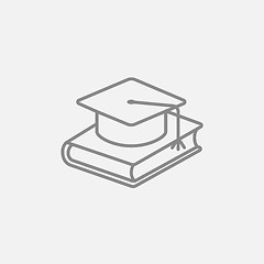 Image showing Graduation cap laying on book line icon.