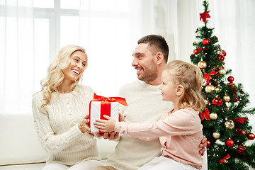 Image showing happy family at home with christmas gift box