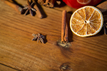 Image showing cinnamon, anise and dried orange on wooden board