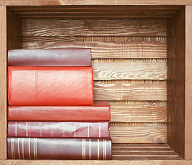 Image showing books on wooden shelf