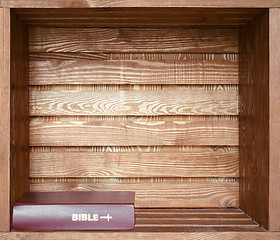 Image showing Bible in old wooden shelf