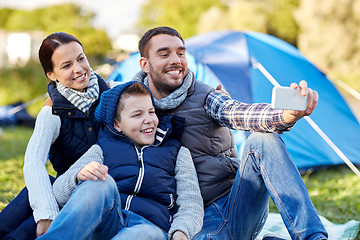 Image showing family with smartphone taking selfie at campsite