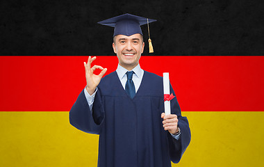 Image showing smiling adult student in mortarboard with diploma