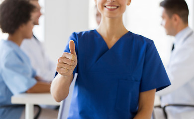 Image showing close up of doctor showing thumbs at hospital