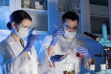 Image showing close up of scientists making test in lab