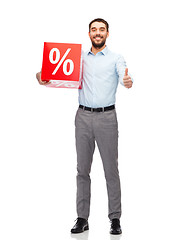 Image showing smiling man with red shopping bag