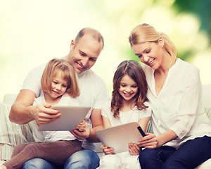 Image showing happy family with tablet pc computers