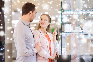 Image showing couple looking to shopping window at jewelry store