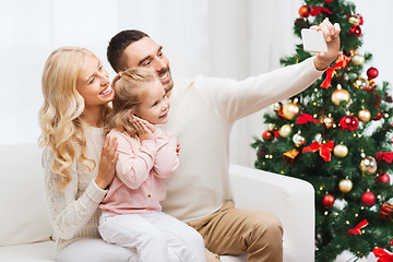 Image showing family taking selfie with smartphone at christmas