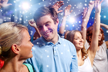 Image showing smiling friends at concert in club