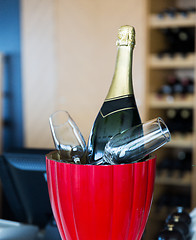 Image showing close up of champagne and glasses at restaurant