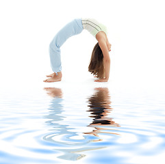 Image showing urdhva dhanurasana upward bow pose on white sand