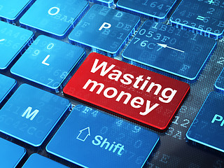 Image showing Banking concept: Wasting Money on computer keyboard background